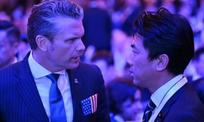 Japan rejects new militarism, says China is rapidly arming