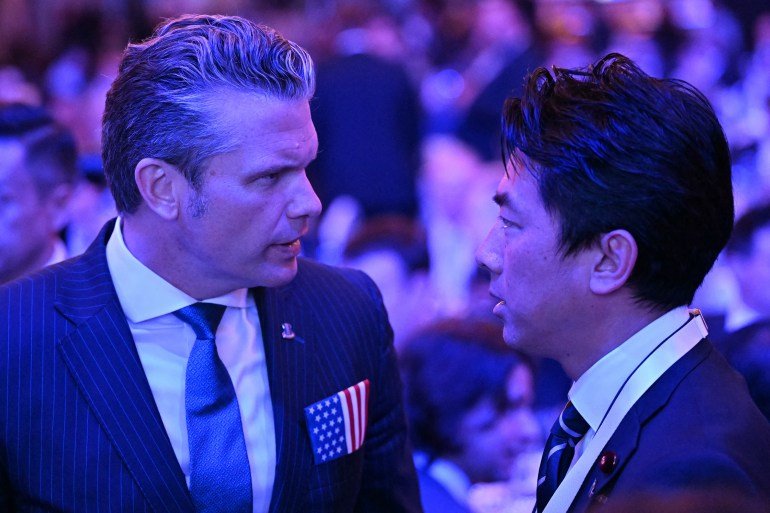 Japan rejects new militarism, says China is rapidly arming