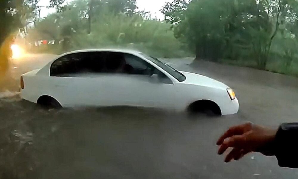 Baby pulled from vehicle trapped in raging floodwaters in dramatic rescue caught on video