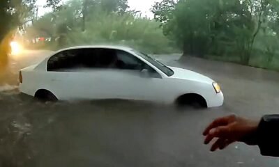 Baby pulled from vehicle trapped in raging floodwaters in dramatic rescue caught on video